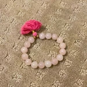 light pink beaded bracelet with pink puff